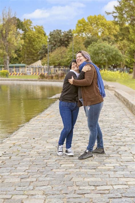 Lesbian Couple Hugging In A Park Stock Image Image Of Bonding Hands