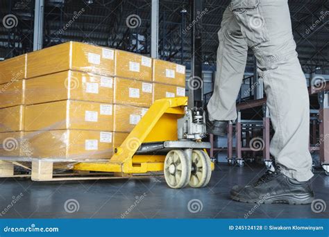 Workers Using Hand Pallet Jack Unloading Packaging Boxes On Pallet Cargo Supply Chain Shipment