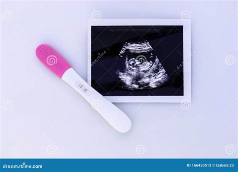Pregnancy Test Showing A Positive Result And Ultrasound Image Stock