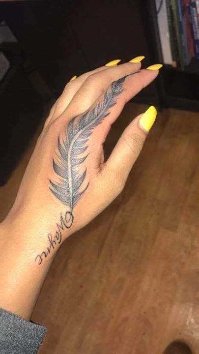The brightly colored tattoos give the symbol a joyous and feminine feel that many women love. Hand Tattoos Pretty Ideas | Feather tattoos, Tattoos, Cute ...