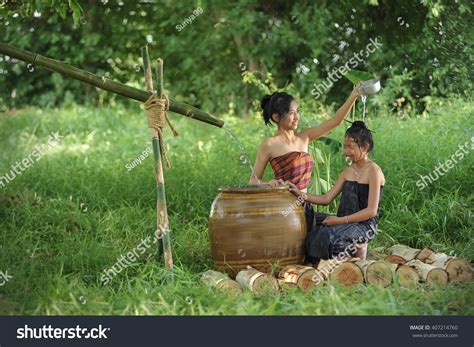 asian village women taking shower foto de stock 407214760 shutterstock