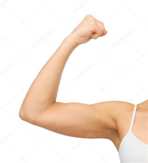 Sporty Woman Flexing Her Biceps — Stock Photo © Sydaproductions 19746937