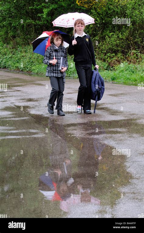 Children Walking To School In The Rain Stock Photo Alamy