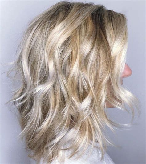 Blonde Wavy Shag With Platinum Highlights Modern Shag Haircut Hair Styles Medium Hair Styles