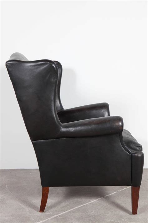 The chesterfield company offers a wide range of flat, scroll and douglas wing chairs.they specially manufacture manchester vintage leather wing chair for more comfort. Black Leather Curved Arm Wing Back Club Chair at 1stdibs