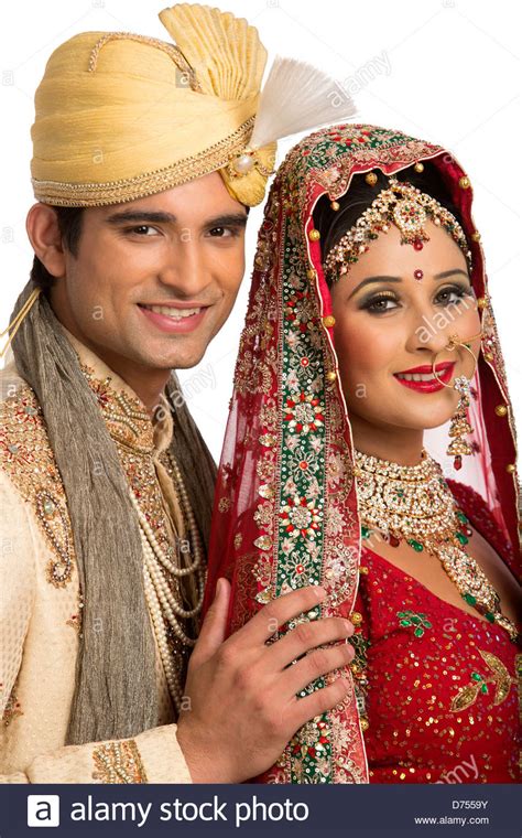 Some couples are lucky enough to. Smiling Indian newlywed couple in traditional wedding ...