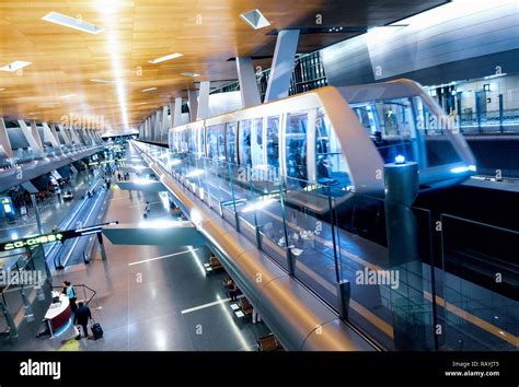 Interior Of Modern Hamad International Airport With Passenger Train In