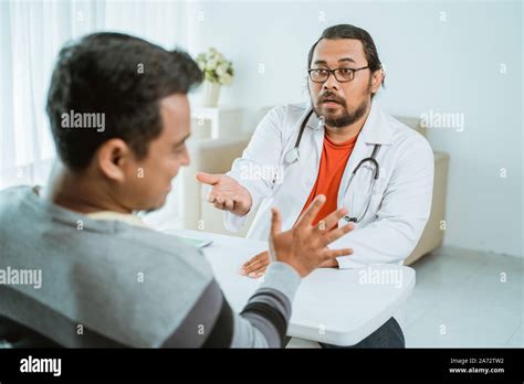 Doctor Asking For His Payment To Patient In Clinic Stock Photo Alamy