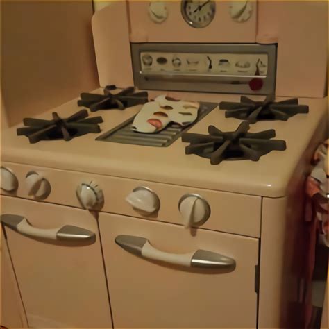 Great storage for play food and pots/pans (play food and pans not included). Pottery Barn Kids Kitchen for sale compared to CraigsList ...