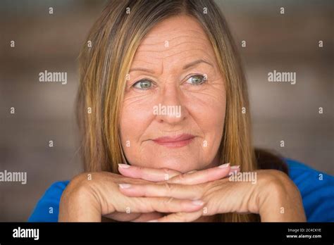 Portrait Attractive Mature Woman With Happy Relaxed Smiling Facial Expression Chin On Hands
