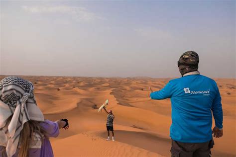 Dubai Desert Quad Bike Safari Camel Ride Sand Surf And Bbq Getyourguide
