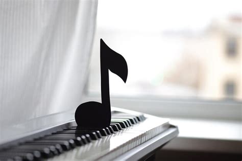 Premium Photo | A black note is on a piano keyboard.