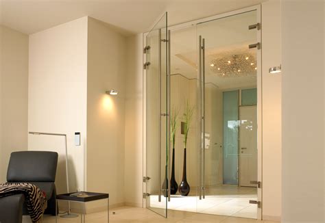 Besides throwing open the interiors of the home to the outside, glass doors have many other benefits. Ceiling high full glass door by Bartels | STYLEPARK