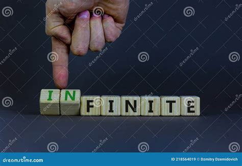 Finite Or Infinite Symbol Businessman Turns Wooden Cubes And Changes