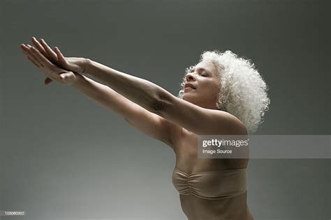 Mature Woman Stretching Photo Getty Images