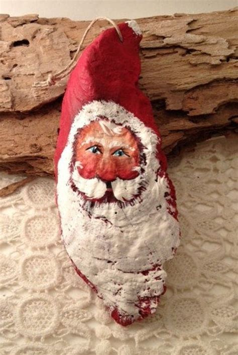 Everyone loves to collect seashells. Old time Santa painted shabby beach oyster sea shell