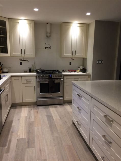 White and gray painted cabinets, countertop and backsplash choices and update decorating a white or gray kitchen with black appliances. Kitchen After: Milky White Shaker Cabinet, Frigidaire ...