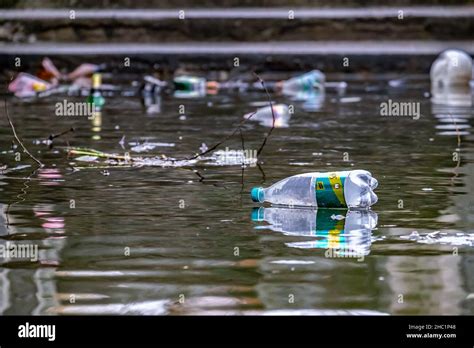 Garbage Floating In The River Plastic Bottles Environmental