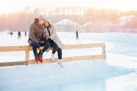 Ice Skating Lover Couple Having Fun On Snow Winter Holidays Stock Photo