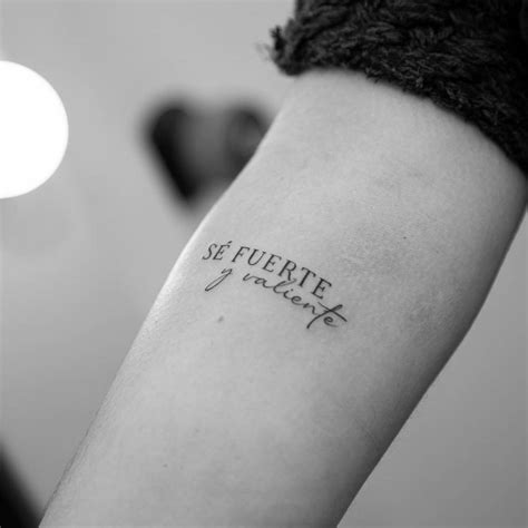 S Fuerte Y Valiente Lettering Tattoo Located On The