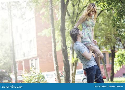 Man Holding A Woman On His Shoulder Stock Image Image Of Sunny