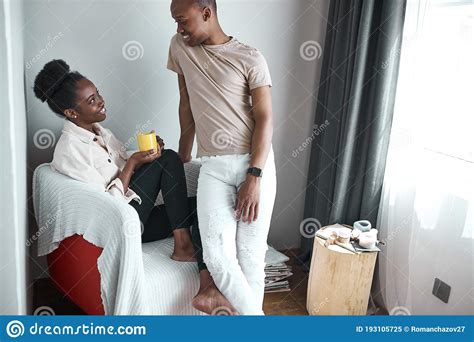 Smiling Happy Dark Skinned Couple Relaxing At Home Stock Image Image