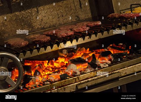 Cooking Meat On A Large Charcoal Grill Stock Photo Alamy