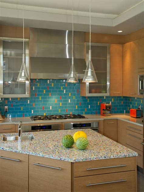 Glass tile is available for backsplashes in just about any style. Rainbow recycled glass countertop with turquoise ...