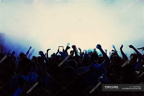 Atmospheric View Of Silhouette Of Crowd At Concert — People Party
