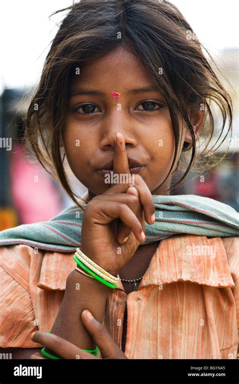 Poor Lower Caste Indian Street Girl Make Shh Gesture Stock Photo