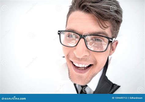Confident Businessman Breaking Through A White Paper Wall Stock Image