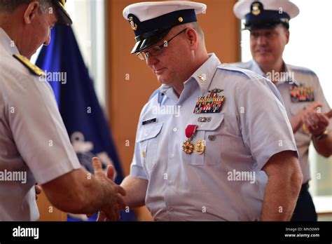 Master Chief Petty Officer Charles Rob Bushey Is Congratulated By