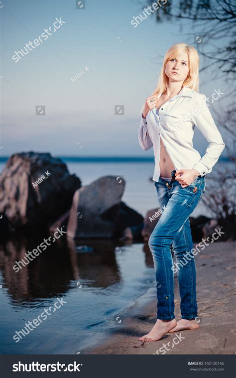 Blonde Girl Walking Barefoot Jeans White Stock Photo