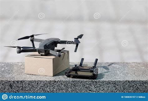 Modern Drone With Cardboard Parcel And Remote Control Stock Image