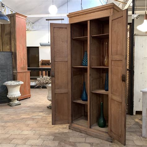 The two locking casters can be adjusted to make the cabinet moveable or stationary. Oak cabinet with 2 doors