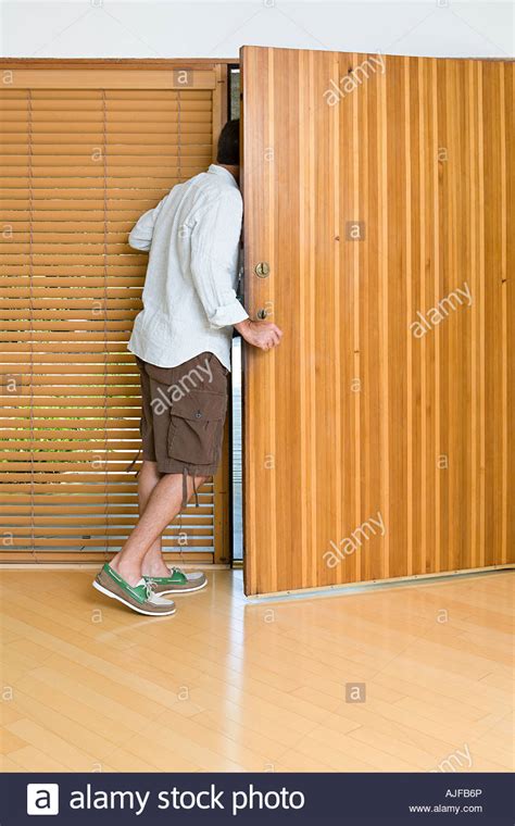 Man Opening Front Door Stock Photo Royalty Free Image 14721021 Alamy