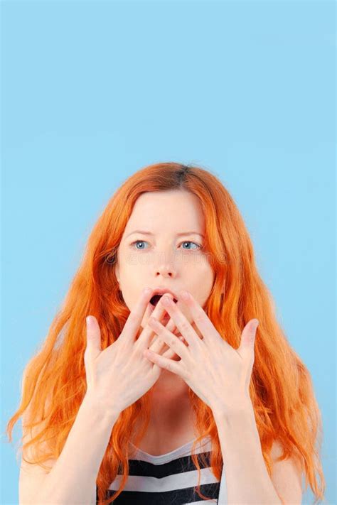 Redhead Girl Covers Her Mouth With Her Hand Surprise And Shock Stock