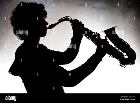 Silhouette Of Man Playing A Saxophone Hi Res Stock Photography And