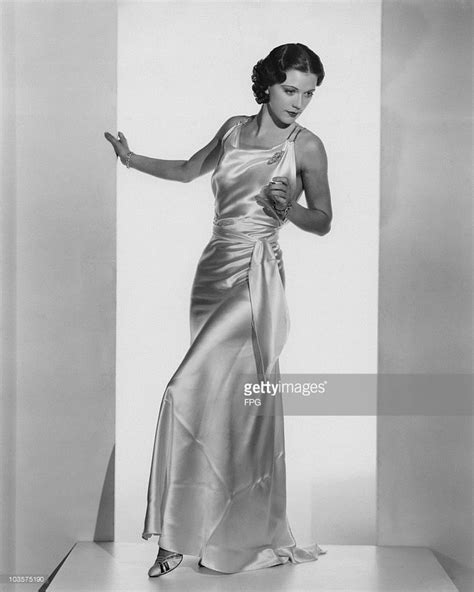 Actress And Dancer Eleanor Powell Pictured Wearing A White Satin