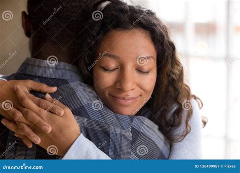 Happy African American Wife Hugging Husband Holding Tight Feelin Stock