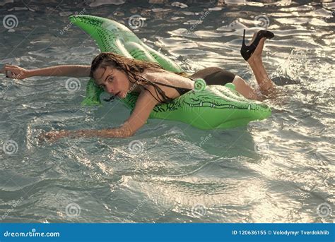 Summer Rest Portrait Of A Beautiful Woman Lying On Air Mattress In