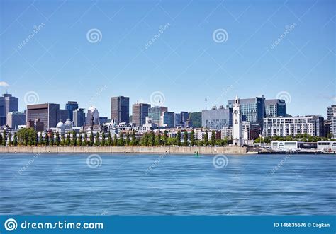View Of Montreal Cityscape The Clock Tower And Saint Lawrence River In