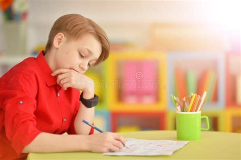 Cute Boy Drawing With Pencils Stock Photo Image Of School Desk 92850520