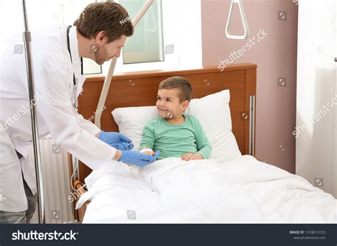 Doctor Adjusting Intravenous Drip Little Child Stock Photo 1318013723