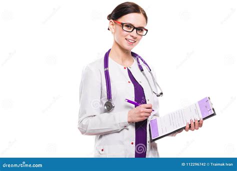Young Beautiful Female Doctor Holding Clipboard And Pen In Her Hands On