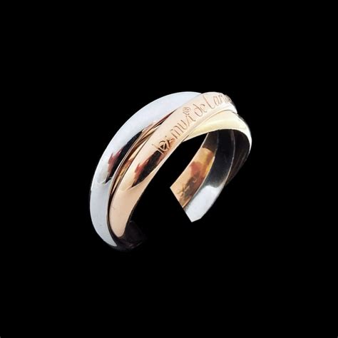 La visualisation des articles sur moins de colonnes est activée. Bague Cartier Trinity Trois Ors