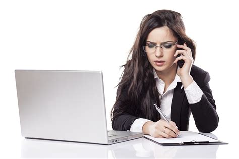 business woman at the desk with a laptop talking on the phone | Morgan ...