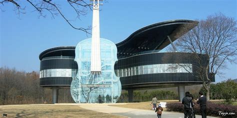 Amazing Unusual House Design With Guitar Shaped Wide Glass Window Along