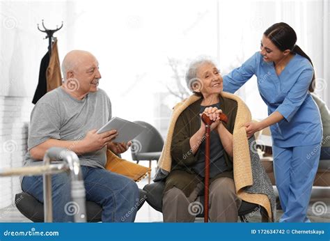 Nurse Taking Care Of Elderly Patients In Hospice Stock Photo Image Of