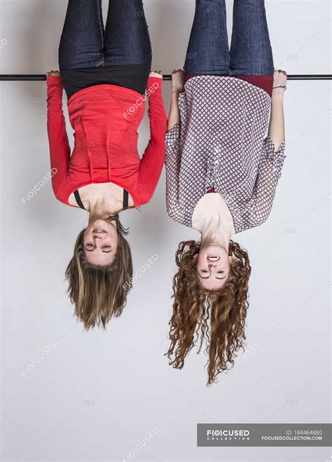 Young Women Hanging Upside Down Smiling — People Bonding Stock